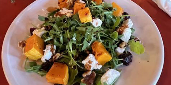 Salad with fresh greens, squash, cheese from Cafe Catron in Santa Fe New Mexico.